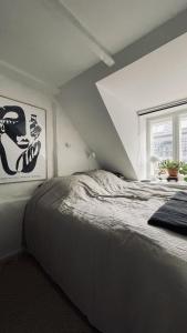 a bedroom with a bed and a window at ApartmentInCopenhagen Apartment 1597 in Copenhagen