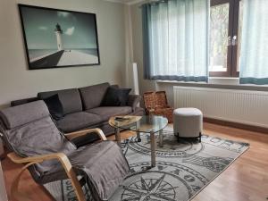a living room with a couch and a table and a lighthouse at Ferienwohnung Hedi in Konz