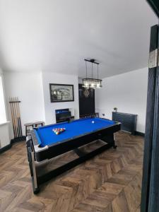 a living room with a pool table in it at city centre - 2 bed house, parking for 2 in Cardiff