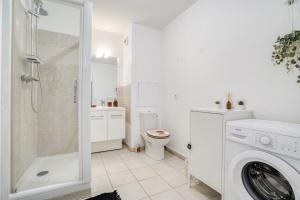 a white bathroom with a shower and a washing machine at Le Colorful Bohème - proche Paris in Rosny-sous-Bois +13 photos