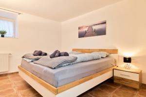 Posteľ alebo postele v izbe v ubytovaní Stilvolle Gartenterrassenwohnung mitten in Bregenz