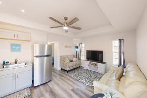 a kitchen and living room with a stainless steel refrigerator at Denton Place Studio in Denton