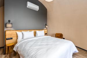 Postel nebo postele na pokoji v ubytování Hotel Qvevrebi