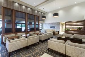 a lobby with couches and tables and windows at Santa Ynez Valley Marriott in Buellton