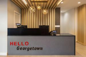 a hotel lobby with a hello georgetown sign on a counter at TownePlace Suites by Marriott Georgetown in Georgetown