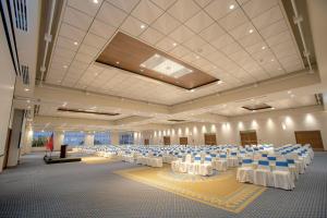 a large banquet hall with white tables and chairs at Hilton Colon Quito Hotel in Quito +59 photos