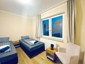 a small room with a bed and a window at Triple Room in Floridsdorf Area in Vienna