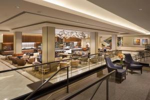 a lobby of a hotel with chairs and tables at Hilton San Francisco Union Square in San Francisco