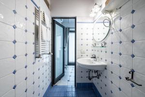 a bathroom with a sink and a mirror at Cortile Santa Monaca in Florence