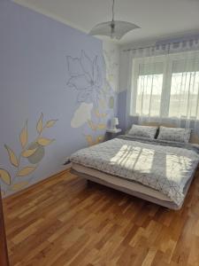 Una cama o camas en una habitación de Apartman Vukan