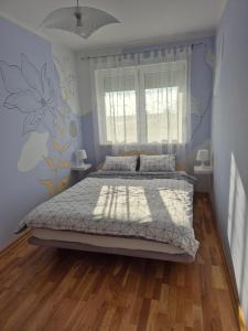 Una cama o camas en una habitación de Apartman Vukan