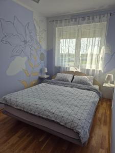 Кровать или кровати в номере Apartman Vukan