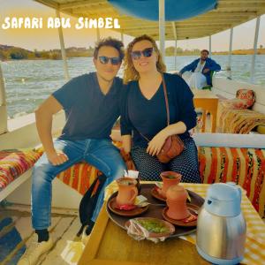 a man and a woman sitting on a boat at Safari Abu Simbel in Abu Simbel