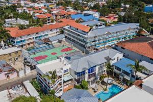 an overhead view of a building with a tennis court at Studio Apartment Center of Sosua close to Beach with Pool View in Sosúa