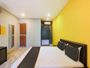 Ένα ή περισσότερα κρεβάτια σε δωμάτιο στο Hotel O MAP INN +22 φωτογραφίες