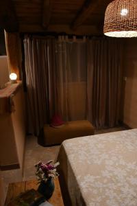 Łóżko lub łóżka w pokoju w obiekcie La Ventanita de Maima