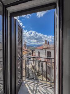a view from a window of a balcony at Casetta San Giorgio in San Giorgio Lucano
