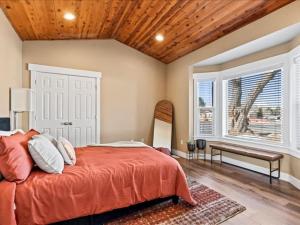 a bedroom with a large bed and a window at Downtown Heber Hangout in Heber City