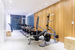 a row of exercise bikes in a fitness room at Gente del Sur - Pacifico in Ushuaia