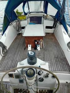 a wooden deck of a boat in the water at Joli voilier de 13m in Les Trois-Îlets