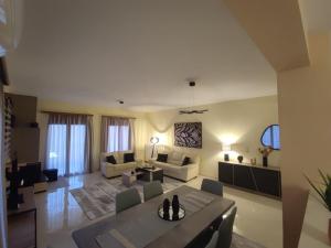 a large living room with a table and chairs at Sunset View in Ioannina