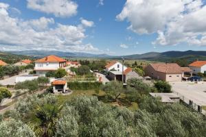 a small village with houses and a road at Holiday house with a parking space Drnis, Zagora - 22772 in Drniš
