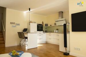 Η κουζίνα ή μικρή κουζίνα στο Haus im Süden Wangerooge +15 φωτογραφίες