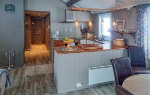 a kitchen with a counter and a table in a room at Beautiful Home In Rendalen With 4 Bedrooms in Rendalen