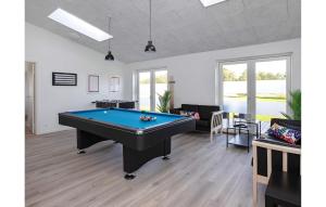 a living room with a pool table in it at Amazing Home In Vejby With Kitchen in Vejby