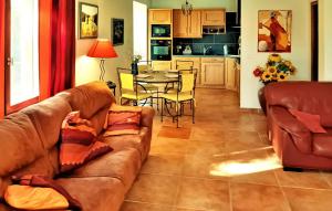 a living room with a couch and a table at Villa La Bulle in Grambois