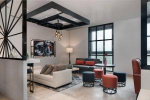 a living room with a couch and a table at Lagos Marriott Hotel Ikeja in Lagos