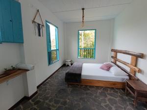 Postel nebo postele na pokoji v ubytování Hostal Payaca