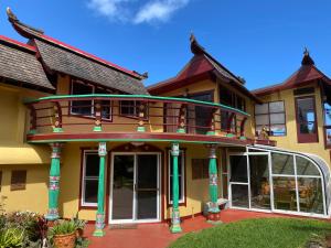 a large house with a large front porch at Maui Eco Retreat in Huelo +41 photos