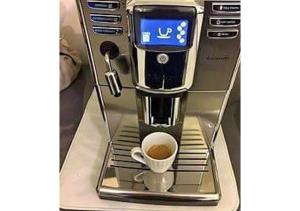 a coffee machine with a cup of coffee at Luxury house Marone in Ischia