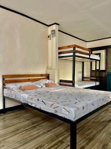 a bedroom with two bunk beds in it at Maria Kulafu Studio Deluxe in Masbate