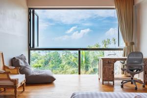 a room with a desk and a large window at 5Bedrooms Villa Hinkong Bay Koh Phangan in Ko Phangan