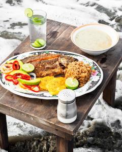 a plate of food on a wooden table at Room in Guest room - Hb8 Quadruple Room with shared bathroom in Cartagena de Indias