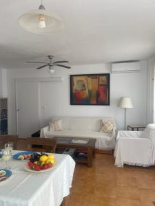 a living room with a couch and a table at Piso Luna in Mojácar