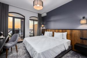 Rúm í herbergi á Hotel Qvevrebi