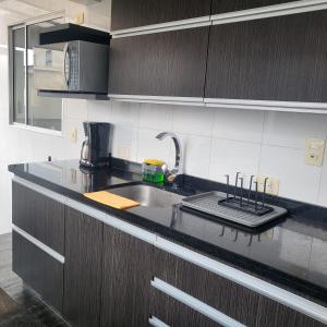 a kitchen with a sink and a counter top at LA CASA DEL CABLE -Comodo Apartamento 102- in Manizales +11 photos