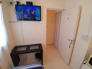 a small room with a television on the wall at Edificio Recoleta in Buenos Aires