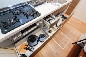 an overhead view of a kitchen with a stove at La Terrasse Higashikomagata - Vacation STAY 17380v in Tokyo