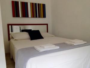 Кровать или кровати в номере Itamambuca Casa de Praia