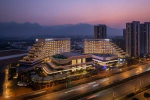a group of buildings in a city at night at Sheraton Pujiang in Jinhua