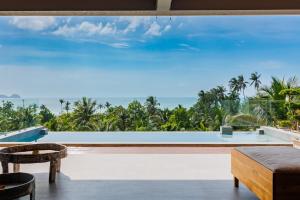 a view of the ocean from the living room of a villa at 5Bedrooms Villa Hinkong Bay Koh Phangan in Ko Phangan