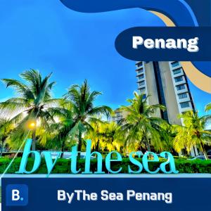un edificio junto al mar, junto al mar, penando por estas penas en By The Sea Penang en Batu Ferringhi