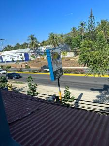 a street sign sitting on the side of a road at Brisa del mar #7 in Puerto Escondido