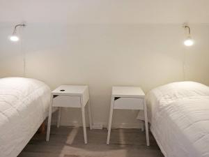 two beds sitting next to each other in a room at 6 person holiday home in KUNGSHAMN in Kungshamn