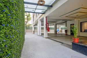 a hallway of a building with a green wall at Lance 21 - Ashok Nagar in Chennai