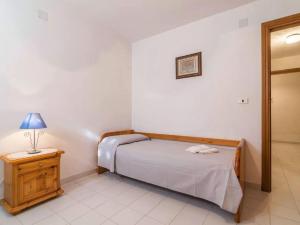 Ένα ή περισσότερα κρεβάτια σε δωμάτιο στο Holiday Home Stintino with Stunning Sea View